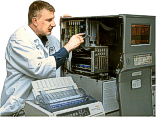 A Service Engineer/Technician checking critical internal parameters to establish the reliability of the instrument for a Reliability Profile on a LECO RH-404 Hydrogen Determinator.